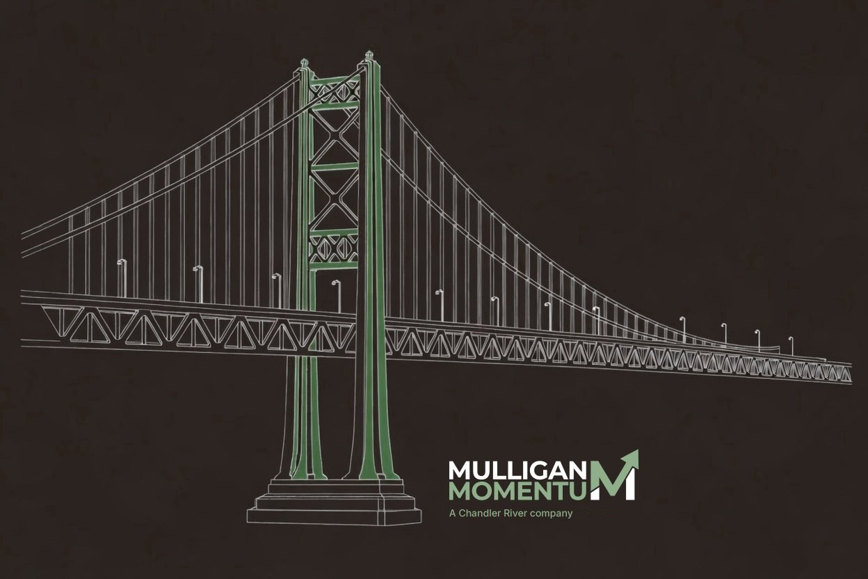 Mulligan Momentum logo, with an upward arrow rising from the M, beside a white line drawing of a suspension bridge whose tower is dark sage green, on charcoal. Division of Chandler River Holdings.